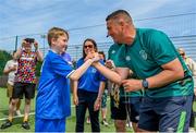 18 June 2023; FAI regional development officer Marc Kenny presents medals to players after the Football For All National Blitz on the Sport Ireland Campus in Dublin. Photo by Seb Daly/Sportsfile