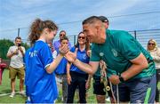 18 June 2023; FAI regional development officer Marc Kenny presents medals to players after the Football For All National Blitz on the Sport Ireland Campus in Dublin. Photo by Seb Daly/Sportsfile