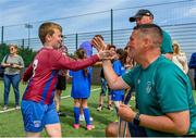 18 June 2023; FAI regional development officer Marc Kenny presents medals to players after the Football For All National Blitz on the Sport Ireland Campus in Dublin. Photo by Seb Daly/Sportsfile