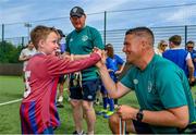 18 June 2023; FAI regional development officer Marc Kenny presents medals to players after the Football For All National Blitz on the Sport Ireland Campus in Dublin. Photo by Seb Daly/Sportsfile