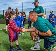 18 June 2023; FAI regional development officer Marc Kenny presents medals to players after the Football For All National Blitz on the Sport Ireland Campus in Dublin. Photo by Seb Daly/Sportsfile