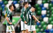 19 June 2023; Northern Ireland players, from left, George Saville, Isaac Price and Paddy McNair after their side's defeat in the UEFA EURO 2024 Championship Qualifier match between Northern Ireland and Kazakhstan at National Stadium at Windsor Park in Belfast. Photo by Ramsey Cardy/Sportsfile