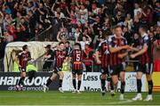 23 June 2023; James Clarke of Bohemians, second from left, celebrates with teammate Grant Horton, 5, after scoring their side's second goal during the SSE Airtricity Men's Premier Division match between Bohemians and Shamrock Rovers at Dalymount Park in Dublin. Photo by Seb Daly/Sportsfile
