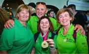 26 June 2023; Team Ireland's Vikki McGill, a member of North West Special Olympics Club, Letterkenny, Donegal, with her mother Carole, dad Michael and Jo McDaid, Operation Director, left, at Dublin Airport on the team's return from the World Special Olympic Games in Berlin, Germany. Photo by Ray McManus/Sportsfile