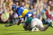 26 June 2004; Eoin Kelly,Tipperary, is tackled by Damien Reale, Tipperary. Guinness Senior Hurling Championship Qualifier, Round 1, Limerick v Tipperary, Gaelic Grounds, Limerick. Picture credit; Ray McManus / SPORTSFILE