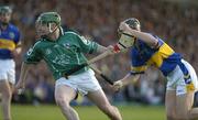 26 June 2004; John Paul Sheehan, Limerick, is tackled by Paul Curran, Tipperary. Guinness Senior Hurling Championship Qualifier, Round 1, Limerick v Tipperary, Gaelic Grounds, Limerick. Picture credit; Pat Murphy / SPORTSFILE