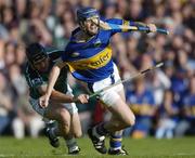 26 June 2004; Paul Kelly,Tipperary, is tackled by TJ Ryan, Limerck. Guinness Senior Hurling Championship Qualifier, Round 1, Limerick v Tipperary, Gaelic Grounds, Limerick. Picture credit; Ray McManus / SPORTSFILE