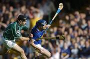 26 June 2004; Paul Kelly, Tipperary, is tackled by TJ Ryan, Limerick. Guinness Senior Hurling Championship Qualifier, Round 1, Limerick v Tipperary, Gaelic Grounds, Limerick. Picture credit; Ray McManus / SPORTSFILE