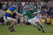 26 June 2004; Andrew O'Shaughnessy, Limerick, is tackled by Philip Maher, Tipperary. Guinness Senior Hurling Championship Qualifier, Round 1, Limerick v Tipperary, Gaelic Grounds, Limerick. Picture credit; Pat Murphy / SPORTSFILE