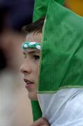 26 June 2004; Twelve year old Barry O'Connor from Kilfinnan, Co. Limerick, shelters from the rain. Guinness Senior Hurling Championship Qualifier, Round 1, Limerick v Tipperary, Gaelic Grounds, Limerick. Picture credit; Ray McManus / SPORTSFILE