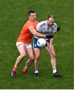 1 July 2023; Conor Boyle of Monaghan is tackled by Paddy Burns of Armagh during the GAA Football All-Ireland Senior Championship quarter-final match between Armagh and Monaghan at Croke Park in Dublin. Photo by Brendan Moran/Sportsfile