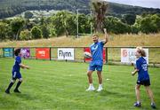 5 July 2023; Leinster player Jordan Larmour celebrates during a Bank of Ireland Leinster Rugby Summer Camp at Stillorgan-Rathfarnham RFC in Dublin. Photo by Harry Murphy/Sportsfile