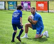 5 July 2023; Leinster player Jordan Larmour with attendees during a Bank of Ireland Leinster Rugby Summer Camp at Stillorgan-Rathfarnham RFC in Dublin. Photo by Harry Murphy/Sportsfile