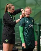 4 July 2023; Goalkeeper Courtney Brosnan and StatSports technician Niamh McDaid during a Republic of Ireland women training session at the FAI National Training Centre in Abbotstown, Dublin. Photo by Stephen McCarthy/Sportsfile