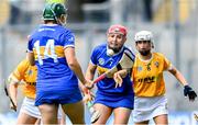 8 July 2023; Aoife McGrath of Tipperary in action against Anna Connolly of Antrim during the All-Ireland Senior Camogie Championship quarter-final match between Tipperary and Antrim at Croke Park in Dublin. Photo by Ramsey Cardy/Sportsfile