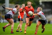 15 July 2023; Blaithín Mackin of Armagh evades the tackle of Roisin Phelan, left, and Emma Cleary of Cork during the TG4 Ladies Football All-Ireland Senior Championship quarter-final match between Armagh and Cork at BOX-IT Athletic Grounds in Armagh. Photo by Ben McShane/Sportsfile
