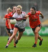 15 July 2023; Katie Quirke of Cork is tackled by Emily Druse of Armagh during the TG4 Ladies Football All-Ireland Senior Championship quarter-final match between Armagh and Cork at BOX-IT Athletic Grounds in Armagh. Photo by Ben McShane/Sportsfile