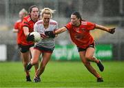 15 July 2023; Katie Quirke of Cork is tackled by Emily Druse of Armagh during the TG4 Ladies Football All-Ireland Senior Championship quarter-final match between Armagh and Cork at BOX-IT Athletic Grounds in Armagh. Photo by Ben McShane/Sportsfile
