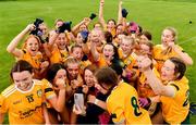 16 July 2023; Antrim players and coaching staff celebrate after their side's vitory in the LGFA All-Ireland U16 C Championship Final match between Clare and Antrim at Clane in Kildare. Photo by Sam Barnes/Sportsfile