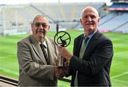 21 July 2023; Former Ballycastle and Antrim hurler Eddie Donnelly, left, receives his Lifetime Achievement Award from Chief Operating Officer of the GPA Ciaran Barr during the GPA Camogie and Hurling Legends lunch at Croke Park in Dublin. Photo by David Fitzgerald/Sportsfile