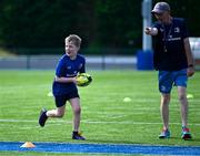 21 July 2023; Oliver Cummins with Leinster coach Paul McGrath during a Leinster Rugby Inclusion Camp at Clontarf RFC in Dublin. Photo by Piaras Ó Mídheach/Sportsfile