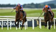 22 July 2023; Henry Longfellow, left, with Ryan Moore up, on their way to winning the Juddmonte Irish EBF Maiden, from second place Mythology, right, with Dylan Browne McMonagle up, during day one of the Juddmonte Irish Oaks Weekend at The Curragh Racecourse in Kildare. Photo by Seb Daly/Sportsfile