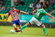 22 July 2023; William Armshaw of Treaty United in action against Rokas Stanulevicius of Cork City during the Sports Direct Men’s FAI Cup First Round match between Treaty United and Cork City at Markets Field in Limerick. Photo by Michael P Ryan/Sportsfile