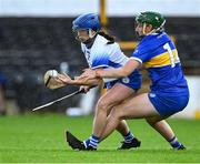 22 July 2023; Vikki Faulkner of Waterford in action against Cait Devane of Tipperary during the All-Ireland Camogie Championship semi-final match between Tipperary and Waterford at UPMC Nowlan Park in Kilkenny. Photo by Piaras Ó Mídheach/Sportsfile