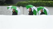 23 July 2023; Umpires, from left, Mark Hawthorne, Jareth McCready and Paul Reynolds before the Certa Women’s One Day International Challenge match between Ireland and Australia at Castle Avenue Cricket Ground in Dublin. Photo by Seb Daly/Sportsfile