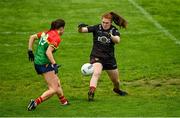 23 July 2023; Down goalkeeper Amy McGivern is tackled by Caoimhe Jordan of Carlow during the TG4 LGFA All-Ireland Junior Championship semi-final match between Down and Carlow at Parnell Park in Dublin. Photo by Eóin Noonan/Sportsfile