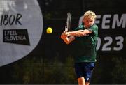 23 July 2023; Zac Naughton of Ireland in action against Peter Zavacky of Slovakia in the Boys Singles Round 1 during 2023 Summer European Youth Olympic Festival at the Branik Tennis Club in Maribor, Slovenia. Photo by Tyler Miller/Sportsfile