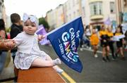 24 July 2023; 7 month old Maisie Farrow watches the parade during the opening ceremony of the FRS Recruitment GAA World Games 2023 in Derry. Photo by Ramsey Cardy/Sportsfile