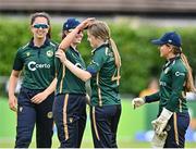 25 July 2023; Georgina Dempsey of Ireland, second from right, celebrates with team-mates including Arlene Kelly, second from left, after bowling Ashleigh Gardner of Australia during match two of the Certa Women’s One Day International Challenge between Ireland and Australia at Castle Avenue in Dublin. Photo by Sam Barnes/Sportsfile