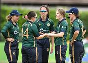 25 July 2023; Georgina Dempsey of Ireland, second from, celebrates with team-mates including Laura Delany, 14, after bowling  Ashleigh Gardner of Australia during match two of the Certa Women’s One Day International Challenge between Ireland and Australia at Castle Avenue in Dublin. Photo by Sam Barnes/Sportsfile
