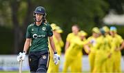 25 July 2023; Orla Prendergast of Ireland leaves the field after being caught out by Alyssa Healy of Australia  during match two of the Certa Women’s One Day International Challenge between Ireland and Australia at Castle Avenue in Dublin. Photo by Sam Barnes/Sportsfile