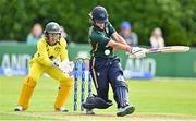 25 July 2023; Gaby Lewis of Ireland is struck in the stomach by the ball as Australia wicket keeper Alyssa Healy watches on during match two of the Certa Women’s One Day International Challenge between Ireland and Australia at Castle Avenue in Dublin. Photo by Sam Barnes/Sportsfile