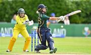 25 July 2023; Gaby Lewis of Ireland reacts after the ball struck her in the stomach as Australia wicket keeper Alyssa Healy watches on during match two of the Certa Women’s One Day International Challenge between Ireland and Australia at Castle Avenue in Dublin. Photo by Sam Barnes/Sportsfile