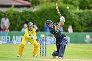 25 July 2023; Gaby Lewis of Ireland bats as Australia wicket keeper Alyssa Healy watches on during match two of the Certa Women’s One Day International Challenge between Ireland and Australia at Castle Avenue in Dublin. Photo by Sam Barnes/Sportsfile