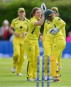 25 July 2023; Georgia Wareham of Australia, second from left, celebrates with team-mates, including Alyssa Healy, right, after bowling Laura Delany of Ireland during match two of the Certa Women’s One Day International Challenge between Ireland and Australia at Castle Avenue in Dublin. Photo by Sam Barnes/Sportsfile