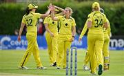 25 July 2023; Georgia Wareham of Australia, centre, celebrates with team-mates, including Tahlia McGrath, left, after bowling Laura Delany of Ireland during match two of the Certa Women’s One Day International Challenge between Ireland and Australia at Castle Avenue in Dublin. Photo by Sam Barnes/Sportsfile