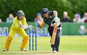 25 July 2023; Arlene Kelly of Ireland bats as Australia wicketkeeper Alyssa Healy watches on during match two of the Certa Women’s One Day International Challenge between Ireland and Australia at Castle Avenue in Dublin. Photo by Sam Barnes/Sportsfile