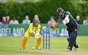 25 July 2023; Laura Delany of Ireland bats watched by Australia wicketkeeper Alyssa Healy during match two of the Certa Women’s One Day International Challenge between Ireland and Australia at Castle Avenue in Dublin. Photo by Sam Barnes/Sportsfile