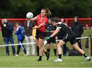 27 July 2023; Daphne Ballard of Canada in action against Leá Garnier of Brittany during day four of the FRS Recruitment GAA World Games 2023 at the Owenbeg Centre of Excellence in Dungiven, Derry. Photo by Piaras Ó Mídheach/Sportsfile
