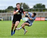 27 July 2023; Shane Gallagher of Canada gets past Alexandre Louzao Carreira of Galicia Blue during day four of the FRS Recruitment GAA World Games 2023 at the Owenbeg Centre of Excellence in Dungiven, Derry. Photo by Piaras Ó Mídheach/Sportsfile