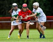 27 July 2023; Amy Challoner of Asia in action against Lana Kernan, left, and Rachel Callanan of Britain 1 during day four of the FRS Recruitment GAA World Games 2023 at the Owenbeg Centre of Excellence in Dungiven, Derry. Photo by Piaras Ó Mídheach/Sportsfile