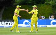 28 July 2023; Phoebe Litchfield of Australia, right, is congratulated by teammate Grace Harris after claiming the wicket of Ireland's Orla Prendergast during match three of the Certa Women’s One Day International Challenge series between Ireland and Australia at Castle Avenue Cricket Ground in Dublin. Photo by Seb Daly/Sportsfile