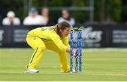 28 July 2023; Georgia Wareham of Australia runs out Ireland's Arlene Kelly, not pictured, during match three of the Certa Women’s One Day International Challenge series between Ireland and Australia at Castle Avenue Cricket Ground in Dublin. Photo by Seb Daly/Sportsfile