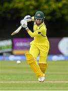 28 July 2023; Phoebe Litchfield of Australia plays a shot to score the winning runs during match three of the Certa Women’s One Day International Challenge series between Ireland and Australia at Castle Avenue Cricket Ground in Dublin. Photo by Seb Daly/Sportsfile