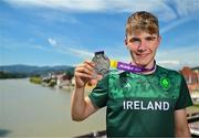 29 July 2023; Conor Murphy of Team Ireland with his time trial Silver medal on the Old Bridge in Maribor during day six of the 2023 Summer European Youth Olympic Festival at in Maribor, Slovenia. Photo by Tyler Miller/Sportsfile