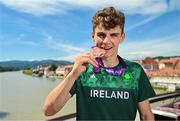 29 July 2023; Cian Crampton of Team Ireland with his discus Bronze medal on the Old Bridge in Maribor during day six of the 2023 Summer European Youth Olympic Festival at in Maribor, Slovenia. Photo by Tyler Miller/Sportsfile